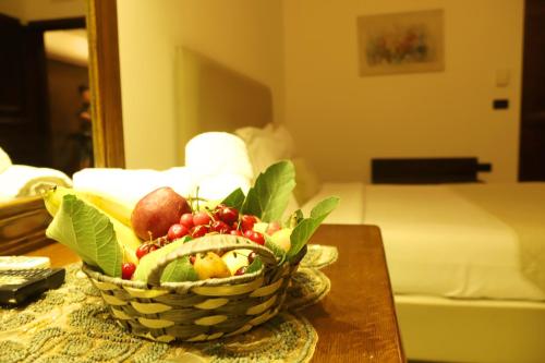 a basket of fruit on a table in a hotel room at Royal Garden Hotel in Beirut
