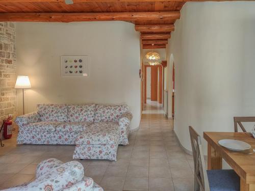 a living room with a couch and a table at Lemon Tree Villa with Private Pool and Starlink Internet in Frés