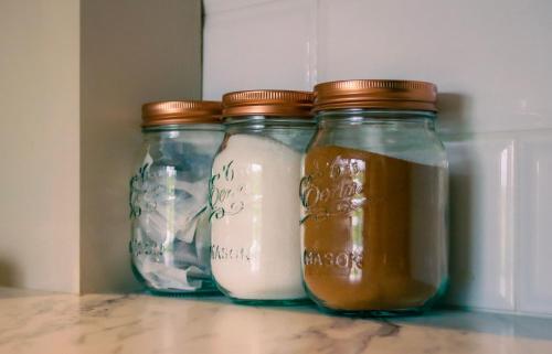 three mason jars filled with milk in a refrigerator at Saul Lodges in Saul