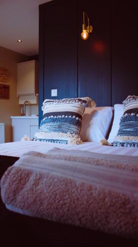a large bed with two pillows on top of it at Saul Lodges in Saul