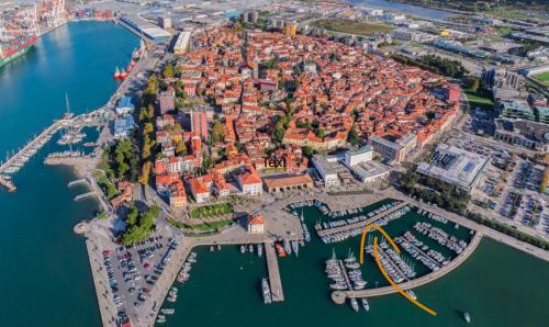 an aerial view of a city with a harbor at Boat studio in Koper