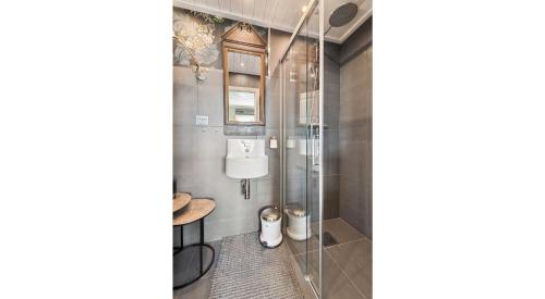 a bathroom with a shower stall and a toilet at Solsiden - in the center of Geilo in Geilo