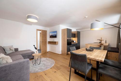 a living room with a couch and a table at Apartments Austria in Söll