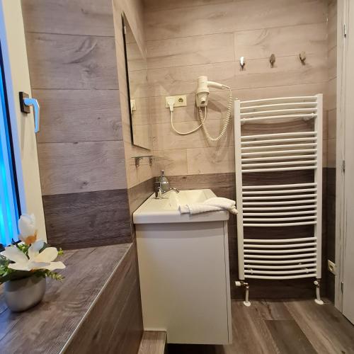 a bathroom with a sink and a mirror at Murzeit Zweite in Murau