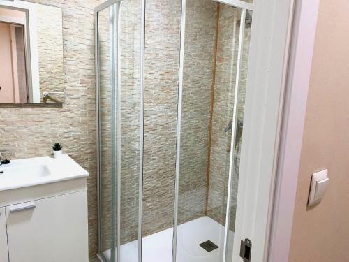 a shower with a glass door in a bathroom at Nest Silence in Valencia