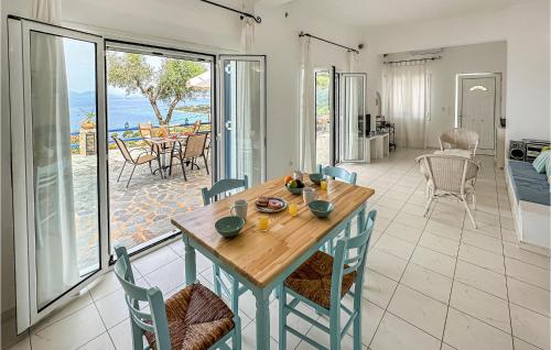 a kitchen and dining room with a table and chairs at 2 Bedroom Lovely Home In Kalamata in Kalamata