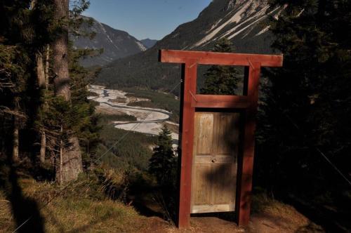 a wooden structure sitting on the side of a mountain at Ferienwohnungen Anja in Steeg