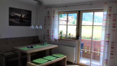 a room with a table and a window and a table at Ferienwohnungen Anja in Steeg