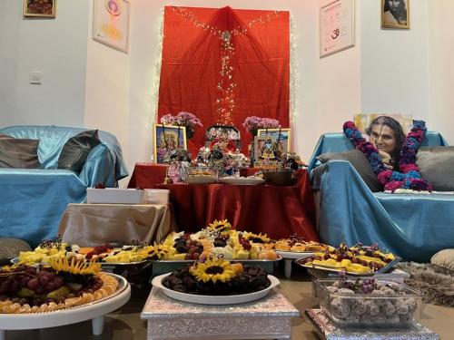 a table filled with lots of different types of food at OM Yoga center in Slovenska Bistrica