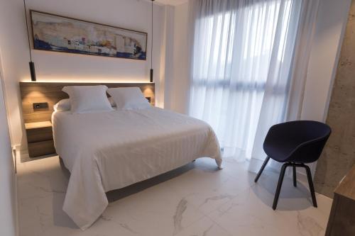 Postel nebo postele na pokoji v ubytování RÍOS SUITES Tudela