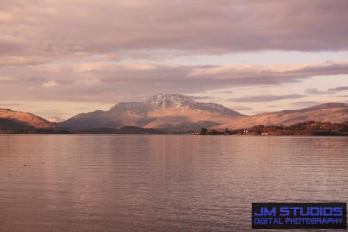 a view of a mountain over a body of water at Culag Lochside Self Catering in Luss