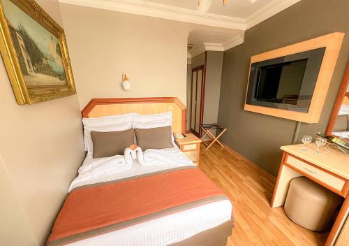 Ένα ή περισσότερα κρεβάτια σε δωμάτιο στο Benler Otel Laleli ISTanbul
