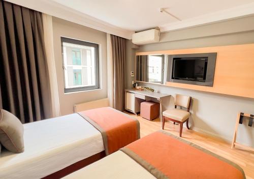 Ένα ή περισσότερα κρεβάτια σε δωμάτιο στο Benler Otel Laleli ISTanbul