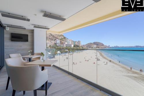 a bar with a view of the beach at Melia Alicante in Alicante