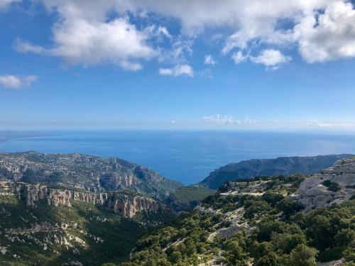 a view of the blue mountains and the ocean at Goloritzè Room and Breakfast in Baunei