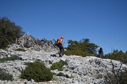 two people walking up a rocky mountain at Goloritzè Room and Breakfast in Baunei