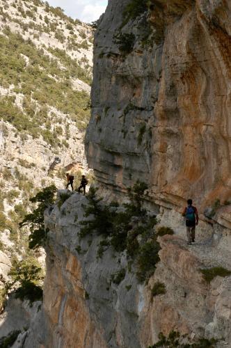 two people walking on a mountain side at Goloritzè Room and Breakfast in Baunei