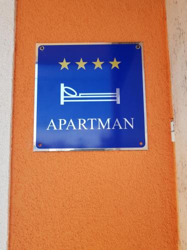 a blue sign on a wall with stars on it at Mediterranean ocean view 4star appartment in Villa in Rijeka