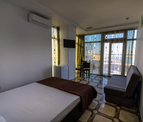 Postel nebo postele na pokoji v ubytování La Perla Bianca Residence