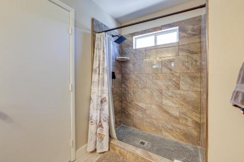 a shower with a glass door in a bathroom at Las Vegas Condo with Private Balcony 10 Mi to Strip in Las Vegas