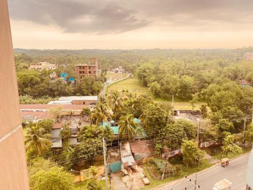 a view of a city from a building at private apartment in hill view tower in Sylhet