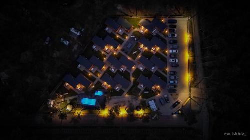an overhead view of a building at night with lights at Seaside Harmony in Pogorzelica