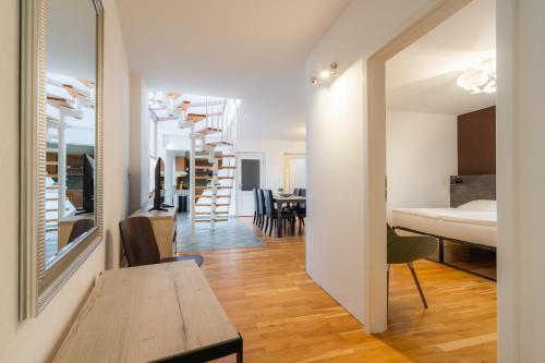 a small apartment with a dining room and a bedroom at EA ApartHotel Melantrich in Prague