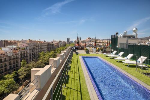 a swimming pool on the roof of a building at Occidental Diagonal 414 in Barcelona