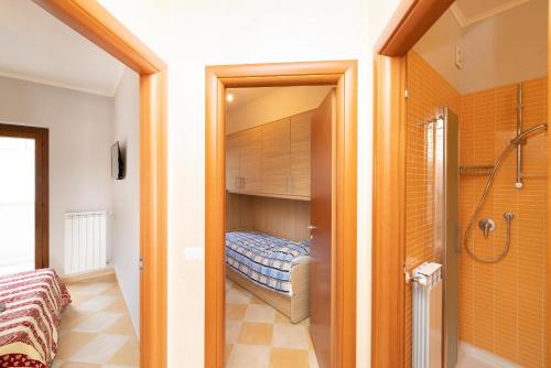 Postel nebo postele na pokoji v ubytování Raggio di Sole by BarbarHouse