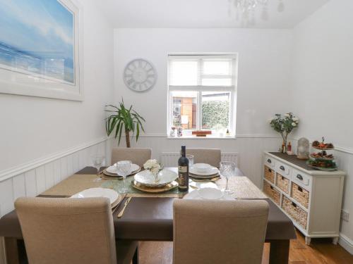 a dining room with a table and chairs at 2 Hartburn Road in North Shields