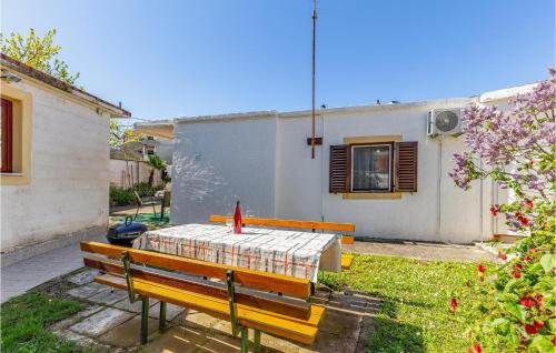 a table in the backyard of a house at Holiday Home Premantura 02 in Premantura