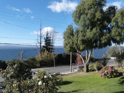 a view of the ocean from a garden at Miralago I in San Carlos de Bariloche