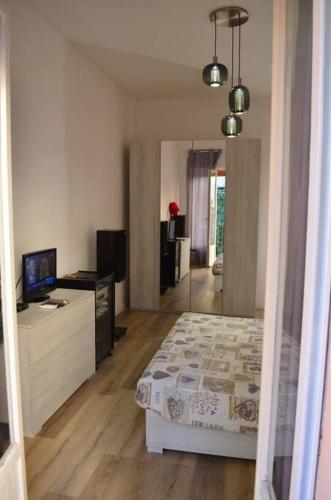 a bedroom with a bed and a television in it at Belvedere di Ancona in Ancona
