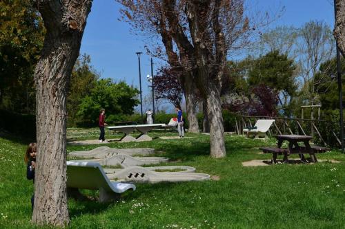 a park with a bunch of picnic tables and trees at Belvedere di Ancona in Ancona