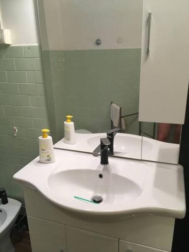 a bathroom with a white sink and a mirror at Belvedere di Ancona in Ancona