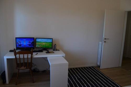 a desk with two computer monitors on top of it at Belvedere di Ancona in Ancona