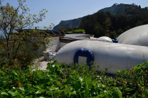 a couple of tanks sitting next to a building at Belvedere di Ancona in Ancona