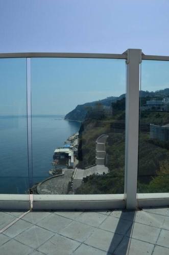 a view of the ocean from a large window at Belvedere di Ancona in Ancona