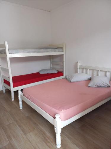 Säng eller sängar i ett rum på Hostel Mar da Vila