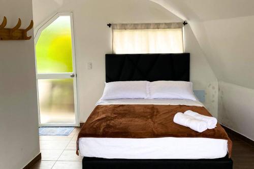 Voodi või voodid majutusasutuse Glamping Arkdia. La Utopía toas