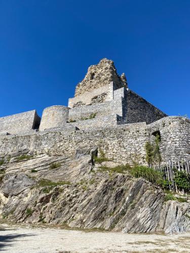 a castle sitting on top of a mountain at Boutique hotel ZBILJE in Zbilje