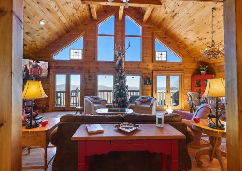 a living room with a large wooden ceiling at Cupids Retreat in Boone