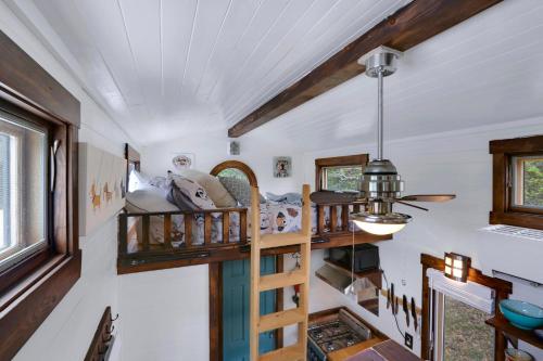 a room with a staircase in a tiny house at Arbor House of Dripping Springs - Hound Hollow in Dripping Springs