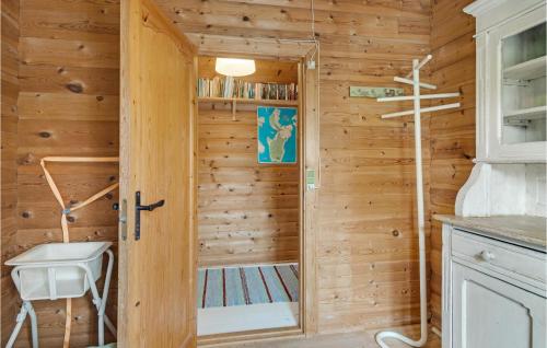 a wooden cabin with a door to a sauna at Pet Friendly Home In Sams With Kitchen in Ballen