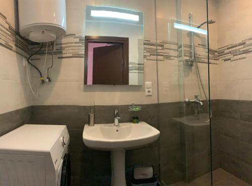 Kylpyhuone majoituspaikassa Orbi Residence Apartment