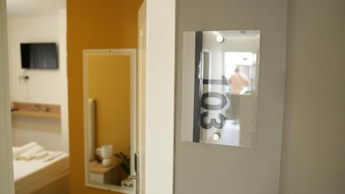 a door with a mirror in a room at Hotel Luris in Golem