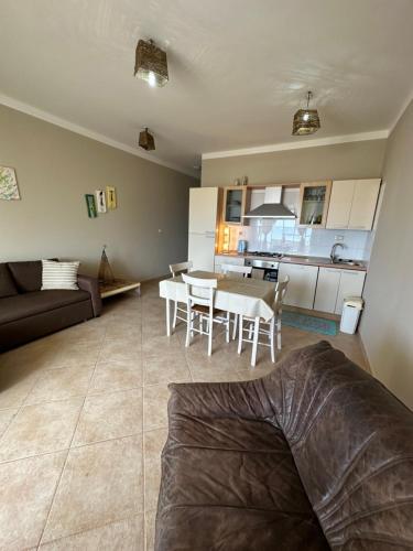 a living room and kitchen with a couch and a table at sea View Nautilus free wi-fi Sal Rei in Sal Rei