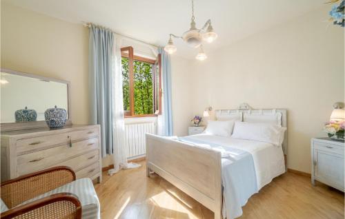 a bedroom with a bed and a dresser and a mirror at Casa La Selva in Cavizzano