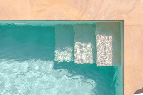 an overhead view of the ocean with acknowled at Disegno Villa - Rooftop Pool in Kolymvari