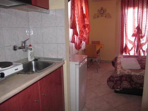 a kitchen with a sink and a counter top at Iliadis House in Sarti